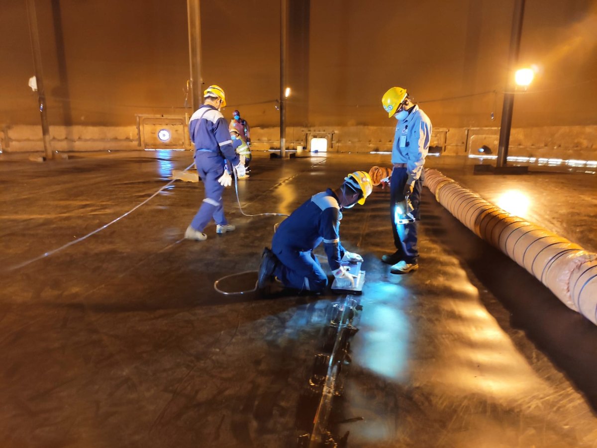 Stormwater team performing containment works inside a tank